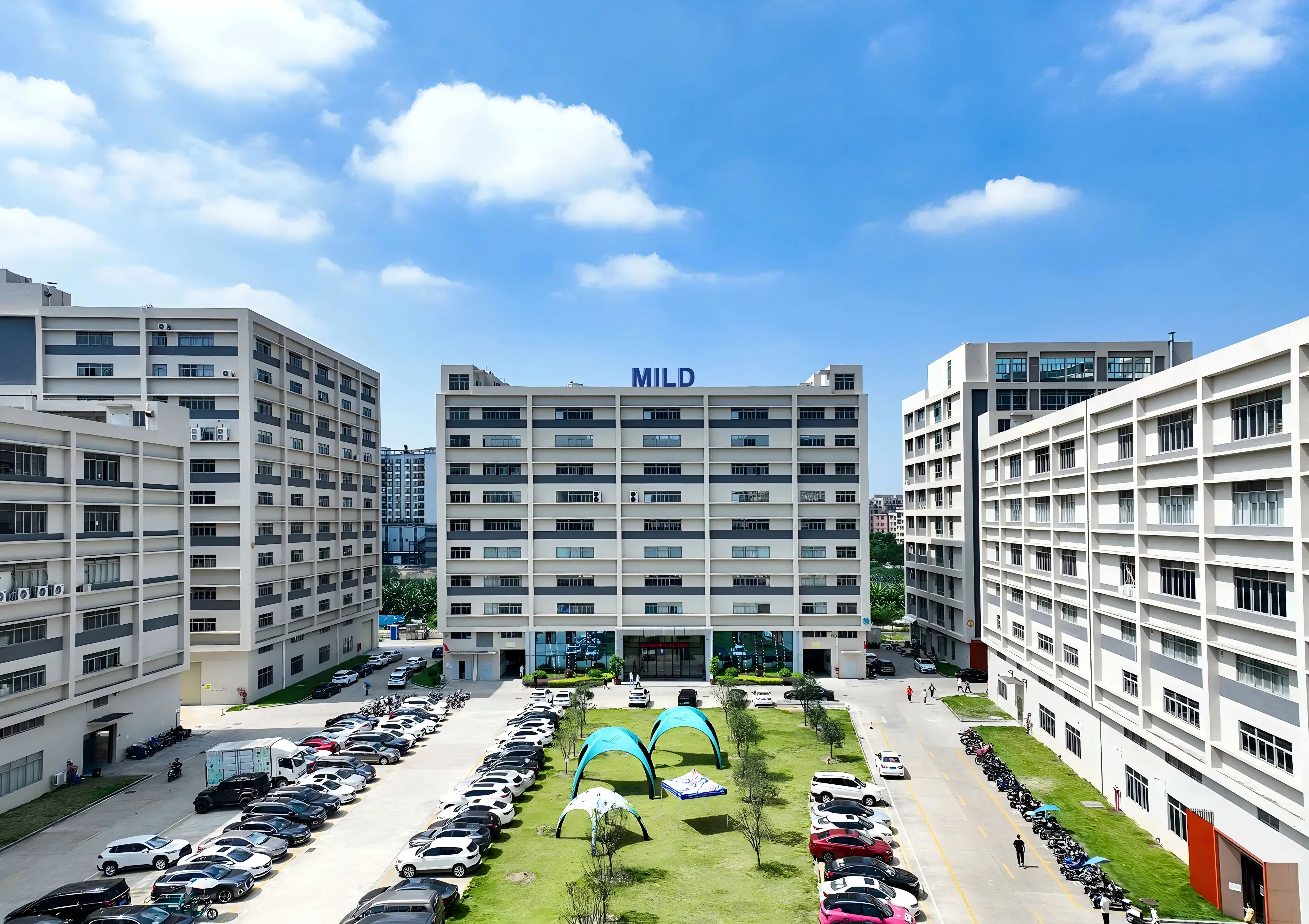 Aerial view of Tentspace headquarters and manufacturing facility in Guangzhou, featuring modern production buildings and outdoor product testing grounds.